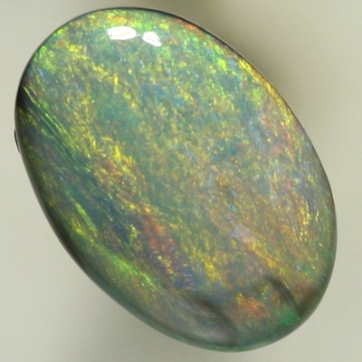 SOLID SEMI BLACK OPAL Sheen pattern with orange and yellow over a background of ocean blue